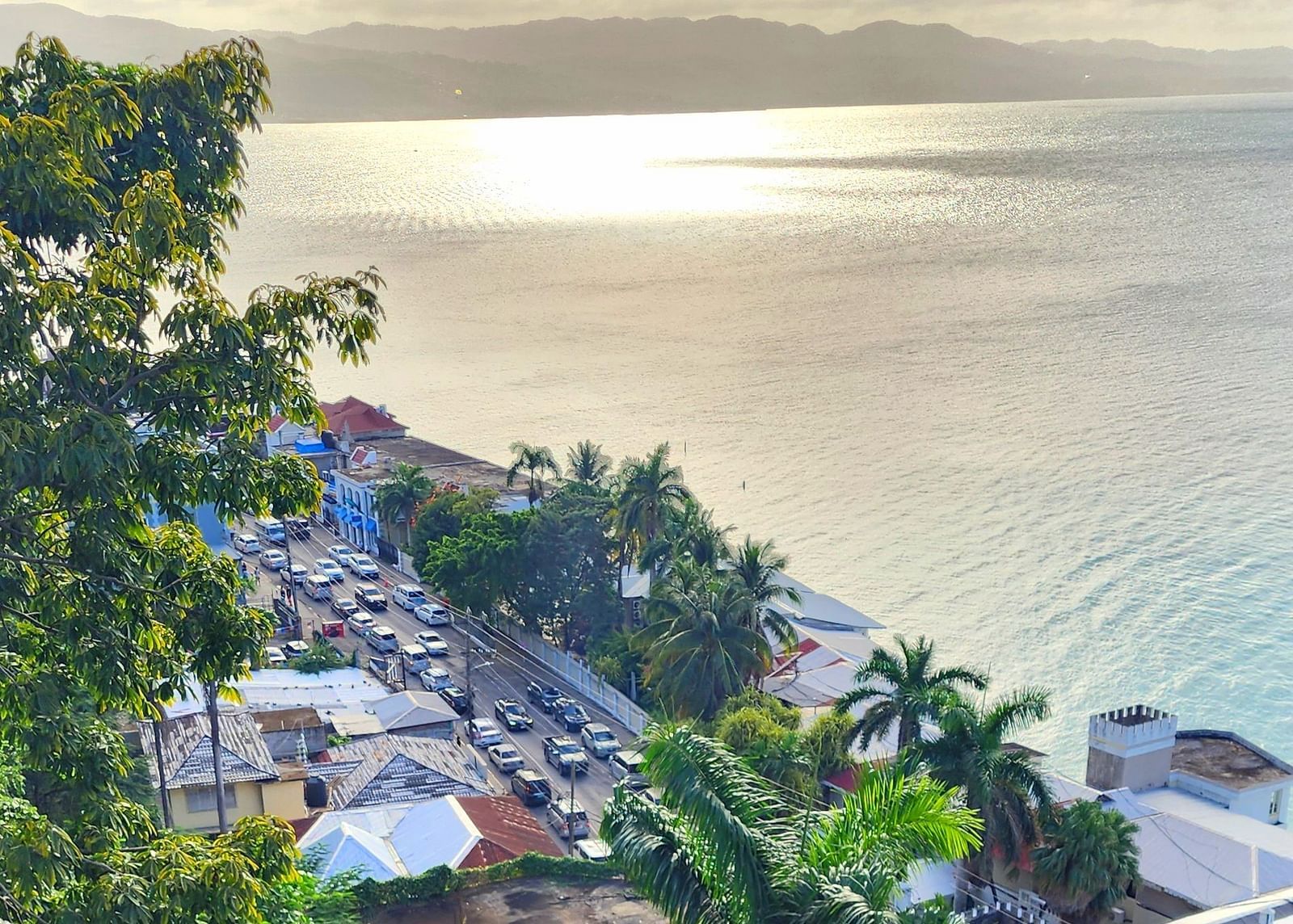 Image of Hip Strip  with sea on the right and a bustling road on the left